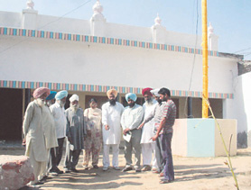 Members of the Trust point out the place where a well belonging to the poet’s house was filled up.